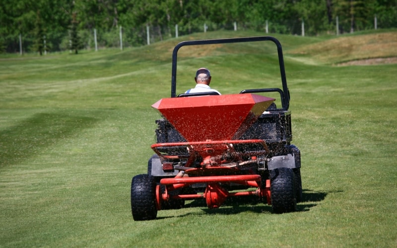 professional spreader on lawn