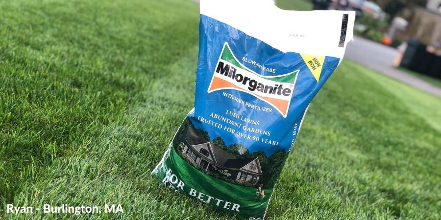 bag of Milorganite fertilizer on a lawn